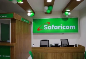 Inside office branded with Safaricom colours and logos.